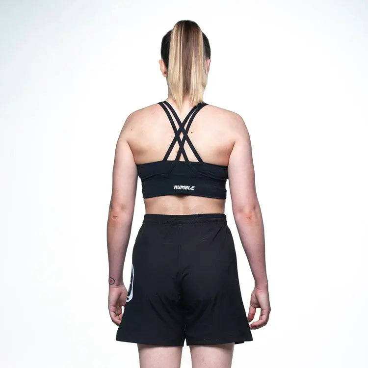 Back of a lady wearing the Assassins MMA Shorts