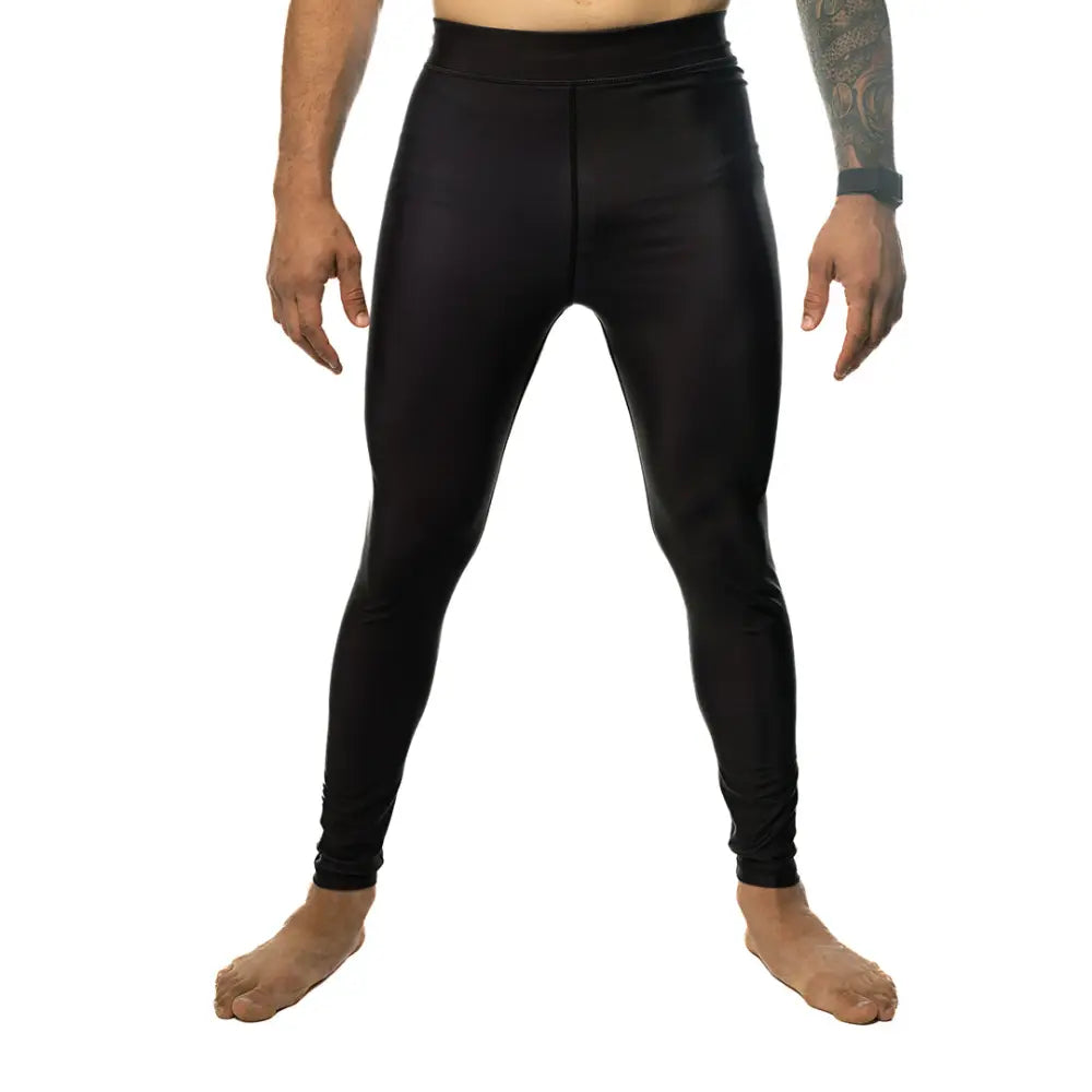 Plain Black spats. Simple logo on the leg