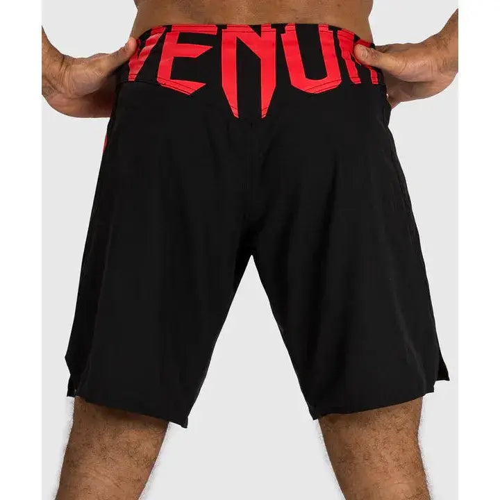 Red Venum logo on the back of the shorts