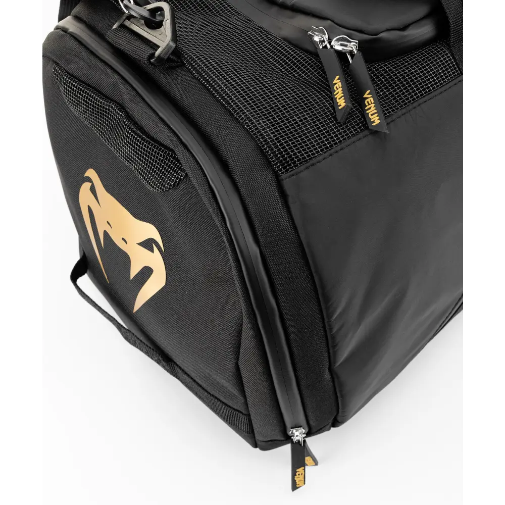 Gold Venum logos highlighted on the bag