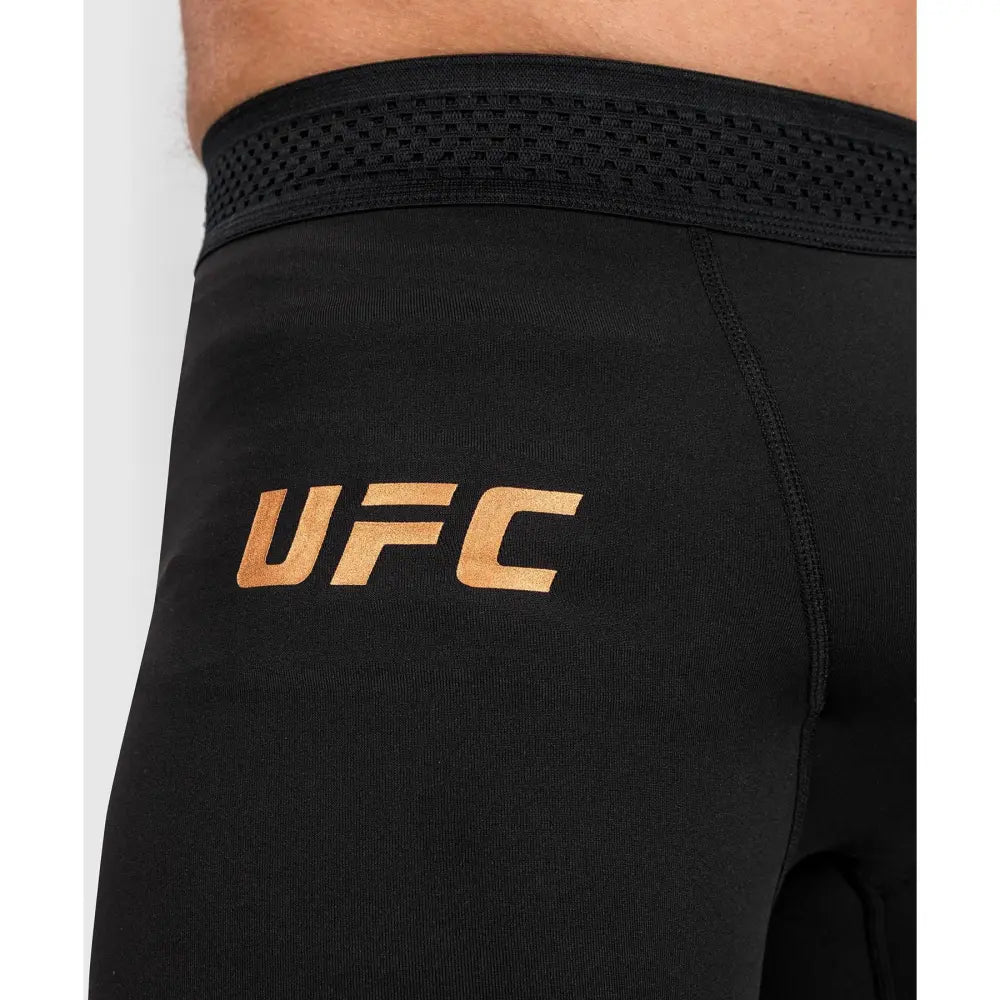 ufc LOGO IN BRONZE/GOLD