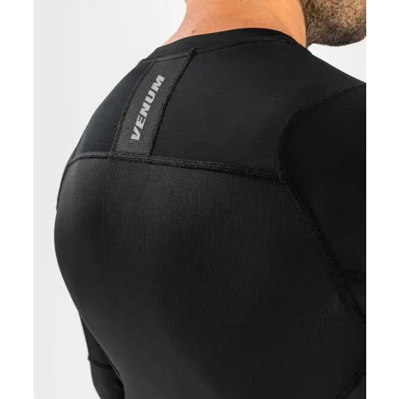 Venum logo on the back of the rashguard