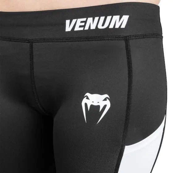 Venum logo on the top of the thigh