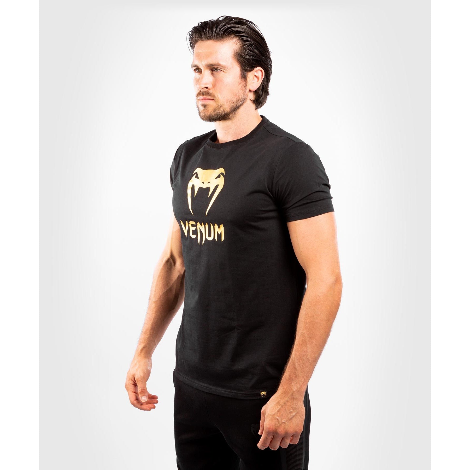 Side view of the crew neck black/gold Venum classic t shirt